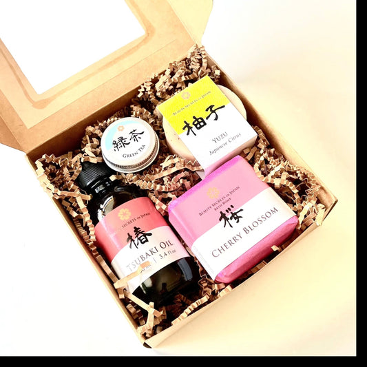 Beauty Secrets of Japan personalized gift set featuring Tsubaki oil, bath bomb, lip balm, and soap in a gift box.