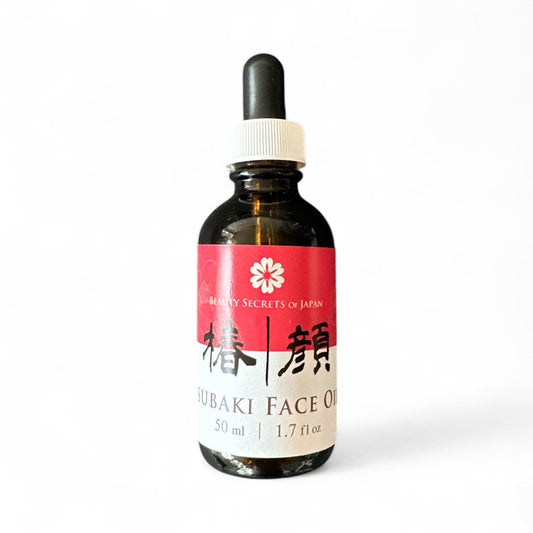 Beauty Secrets of Japan Tsubaki Face Oil in a 50ml amber glass dropper bottle with a red and white label.